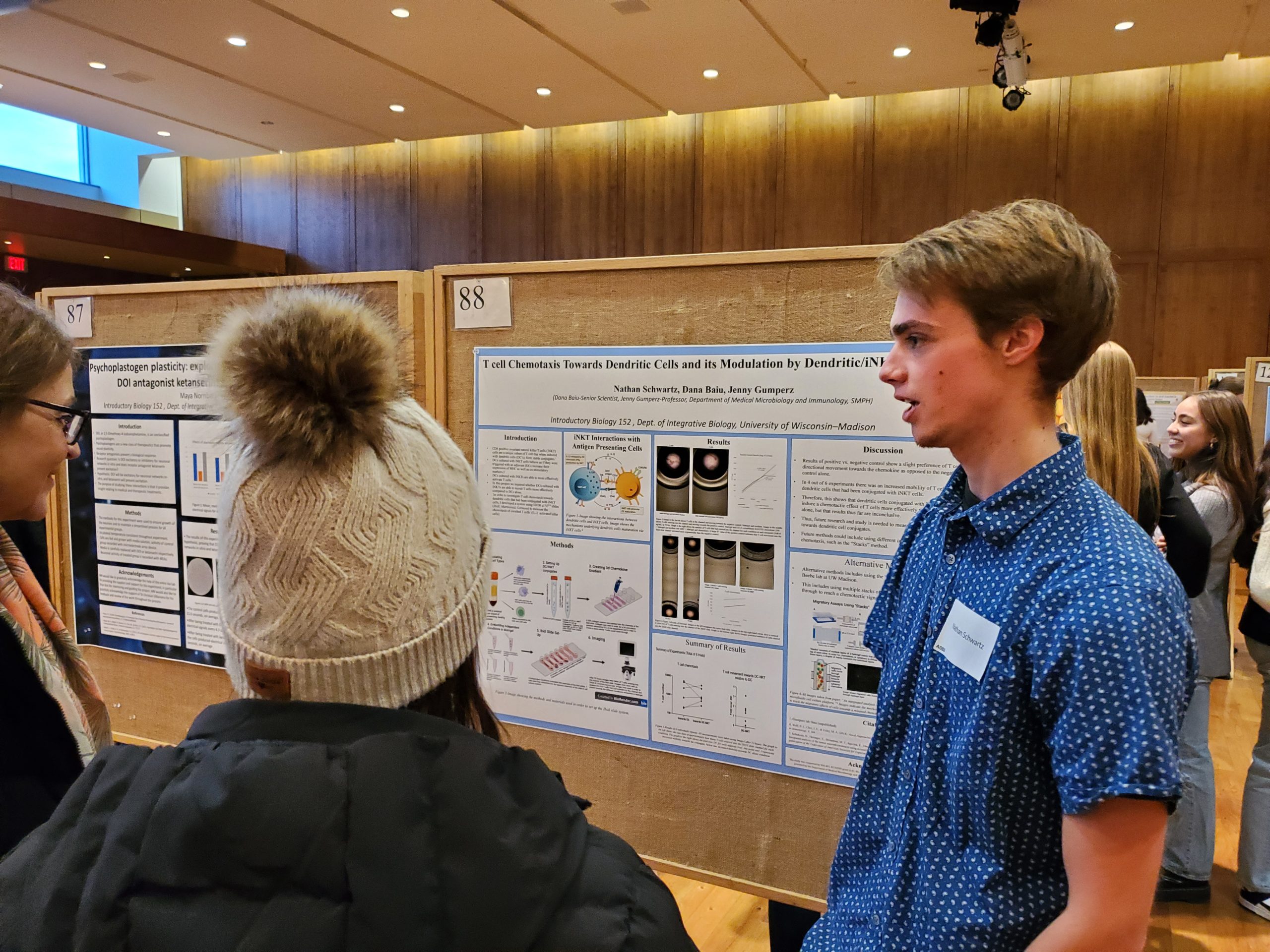 student presenting poster at the symposium